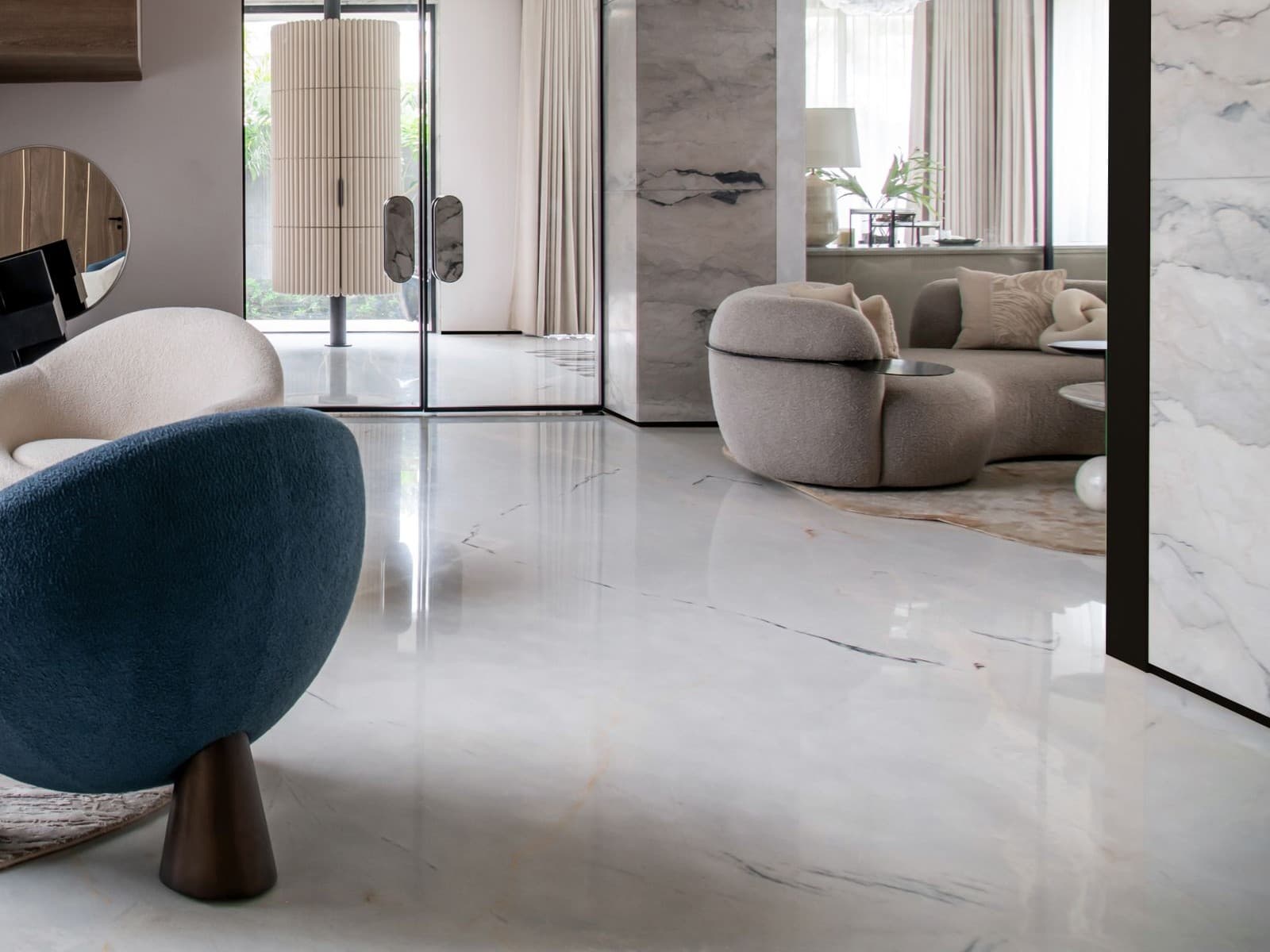 Spacious living room with expansive polished white marble floor